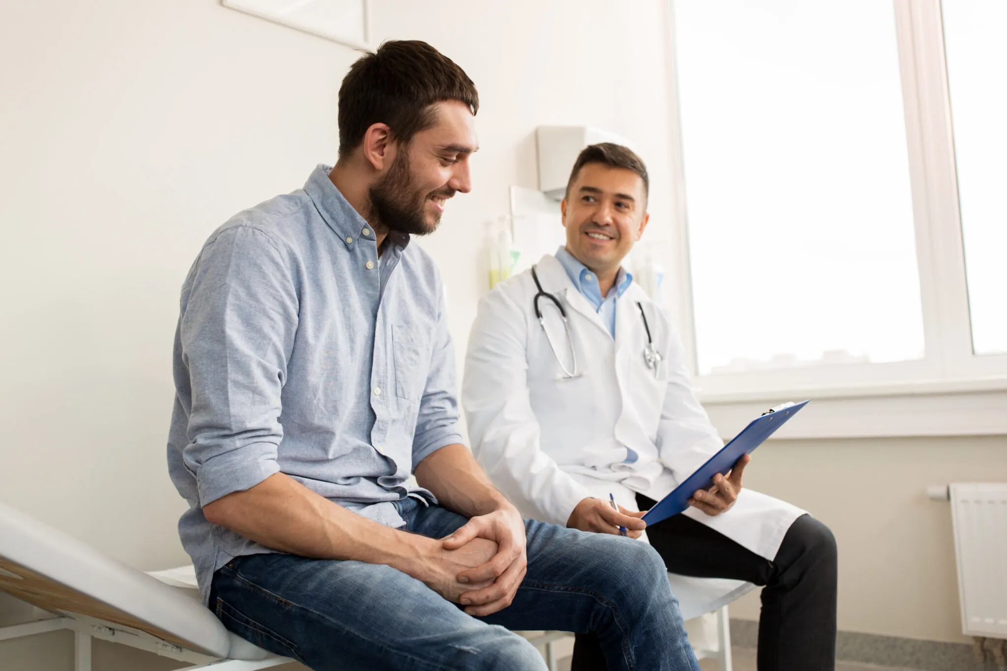 Sleep physician reviewing symptoms with a patient during a consultation