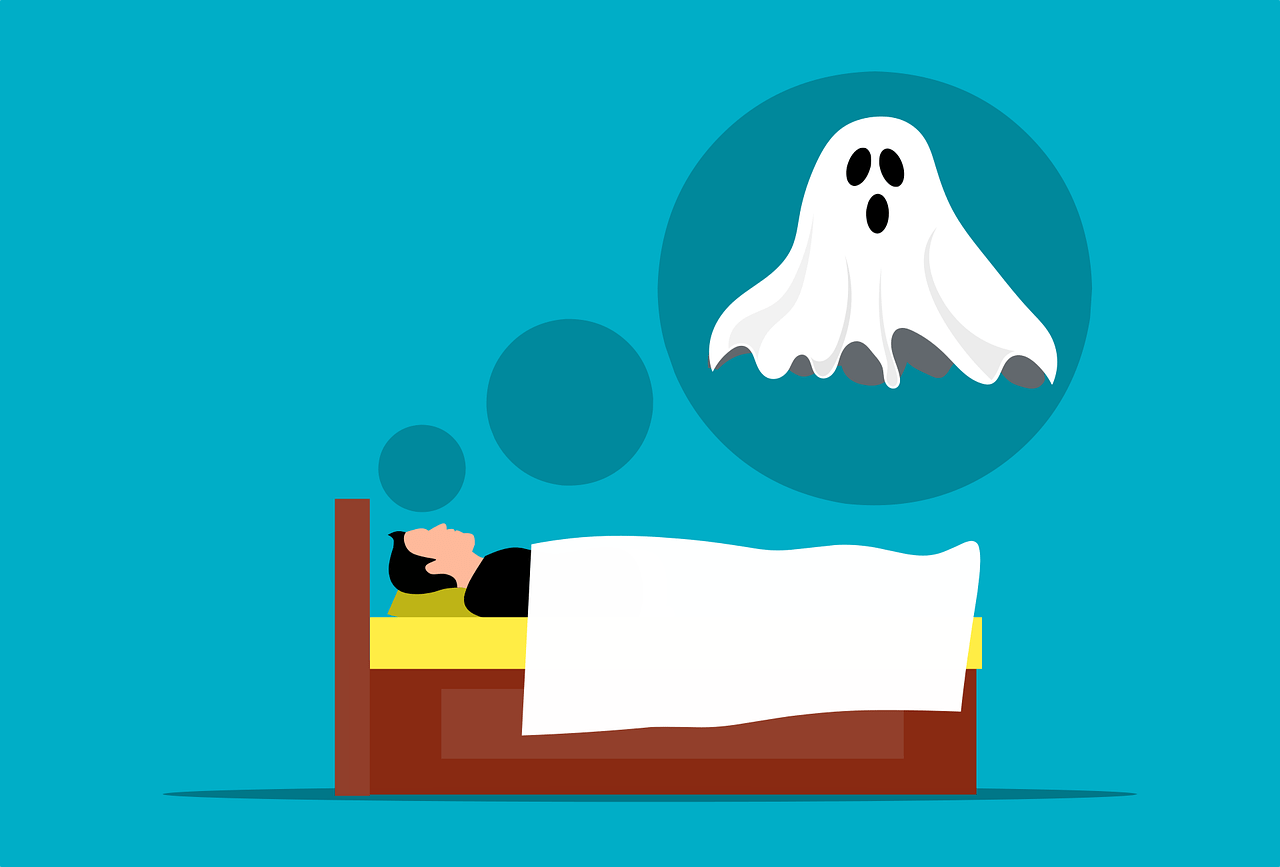 A man lying in bed with a ghost flying above him