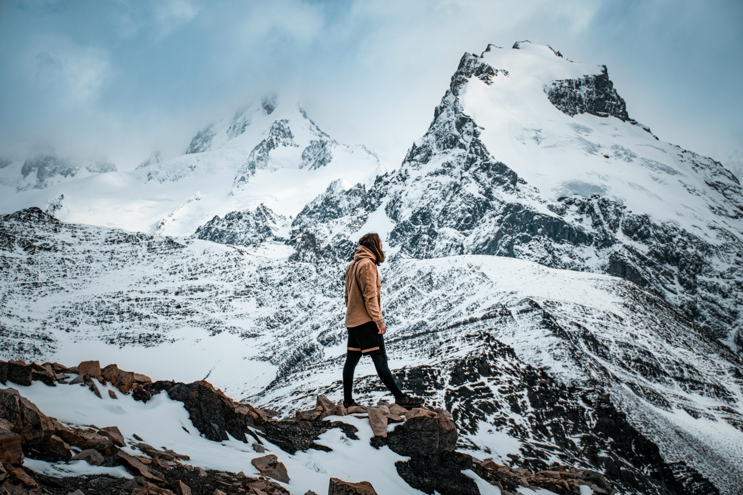 A person walking on a rocky mountain