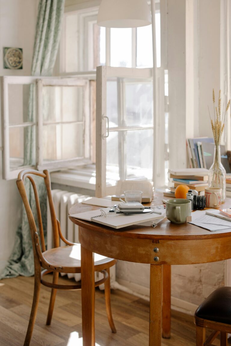 A table with books and a cup on it