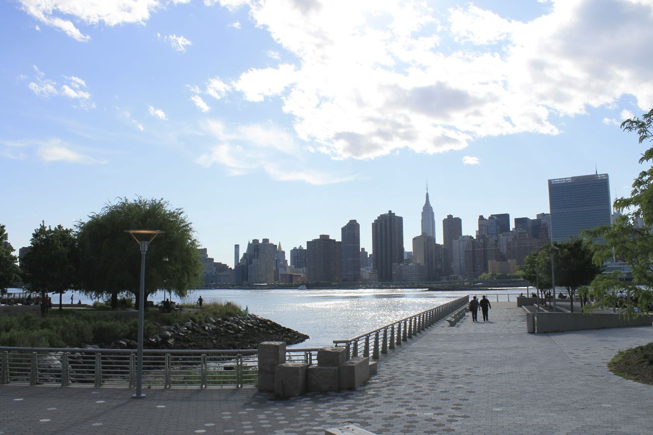 A city skyline with a body of water